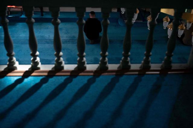A Muslim devotee offers prayers on the first day of Islamic holy fasting month of Ramadan at a mosque in Pristina on February 19, 2026. (Photo by Armend NIMANI / AFP)