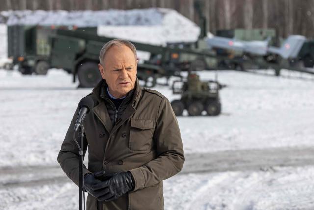 Poland's Prime Minister Donald Tusk speaks to the press after watching an open test of unmanned weapon systems conducted by Polish Armaments Group (Polska Grupa Zbrojeniowa) at the Military Institute of Armament Technology training ground in Zielonka, Warsaw suburbia, on February 19, 2026. (Photo by Wojtek RADWANSKI / AFP)