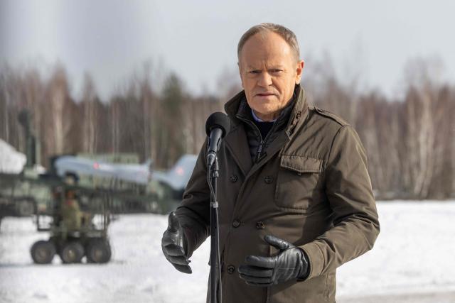 Poland's Prime Minister Donald Tusk speaks to the press after watching an open test of unmanned weapon systems conducted by Polish Armaments Group (Polska Grupa Zbrojeniowa) at the Military Institute of Armament Technology training ground in Zielonka, Warsaw suburbia, on February 19, 2026. (Photo by Wojtek RADWANSKI / AFP)