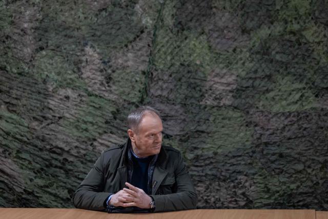 Poland's Prime Minister Donald Tusk is pictured during a military briefing before the beginning of an open test of unmanned weapon systems conducted by Polish Armaments Group (Polska Grupa Zbrojeniowa) at the Military Institute of Armament Technology training ground in Zielonka, Warsaw suburbia, on February 19, 2026. (Photo by Wojtek RADWANSKI / AFP)
