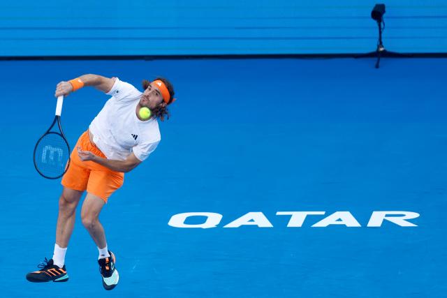Greece's Stefanos Tsitsipas returns the ball to Russia's Andrey Rublev during their men’s singles quarterfinal match at the Qatar Open tennis tournament in Doha on February 19, 2026. (Photo by Karim JAAFAR / AFP)