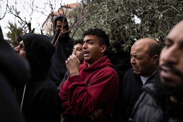 A man grieves during the funeral of 19-year-old Nasrallah Mohammad Siam, during his funeral in Mikhams, in the Israeli-occupied West Bank on February 19, 2026, after he was killed the day before during a Israeli settler attack. Violence in the Palestinian West Bank, which Israel has occupied since 1967, has soared since the Hamas attack on Israel triggered the Gaza war in October 2023. (Photo by JOHN WESSELS / AFP)