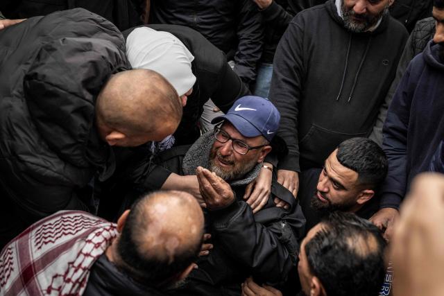 A family member grieves during the funeral of 19-year-old Nasrallah Mohammad Siam, during his funeral in Mikhams, in the Israeli-occupied West Bank on February 19, 2026, after he was killed the day before during a Israeli settler attack. Violence in the Palestinian West Bank, which Israel has occupied since 1967, has soared since the Hamas attack on Israel triggered the Gaza war in October 2023. (Photo by JOHN WESSELS / AFP)