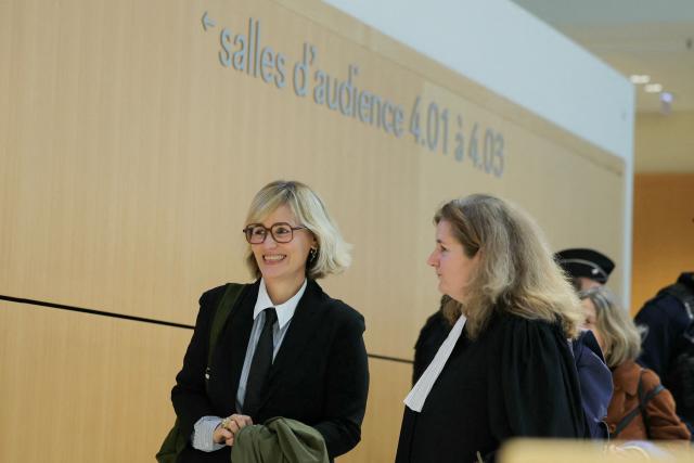 French director and screennwriter Judith Godreche (L) accompanied by French lawyer Laure Heinich arrives at the Paris courthouse in Paris on February 19, 2026, for a procedural hearing before the Paris court, following a defamation complaint by filmmaker Jacques Doillon, whom she accuses of raping her when she was 15. (Photo by Thomas SAMSON / AFP)
