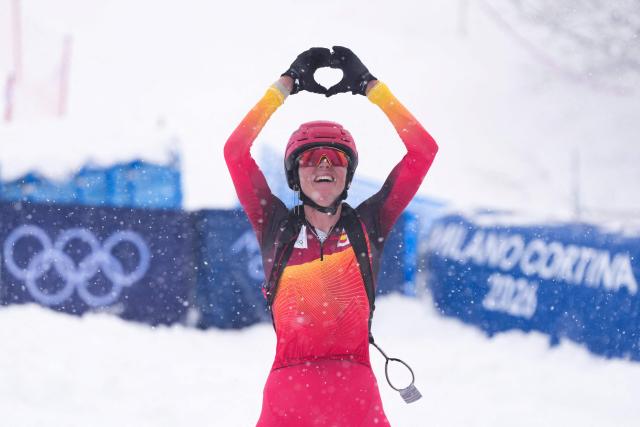 Bronze medallist Spain's Ana Alonso Rodriguez celebrates after competing in the women's sprint ski mountaineering final during the Milano Cortina 2026 Winter Olympic Games at the Stelvio Ski Centre in Bormio (Valtellina) on February 19, 2026. (Photo by Dimitar DILKOFF / AFP)