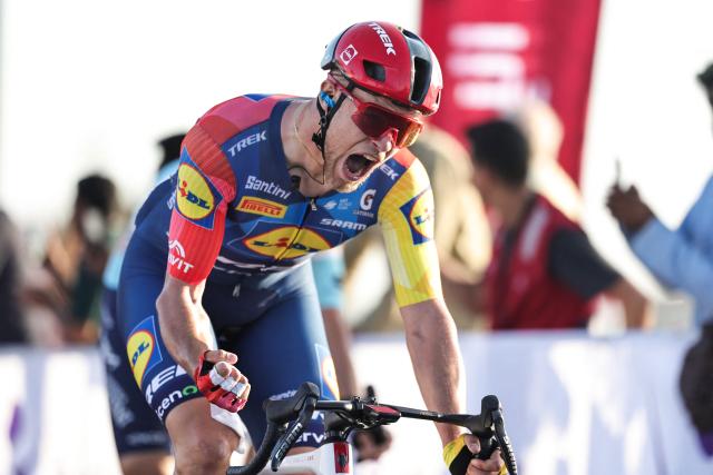 Jonathan Lidl-Trek's Italian rider Jonathan Milan celebrates after crossing the finish line first during the fourth stage of the UAE Tour cycling event in al-Fujairah on February 19, 2026. (Photo by Fadel SENNA / AFP)