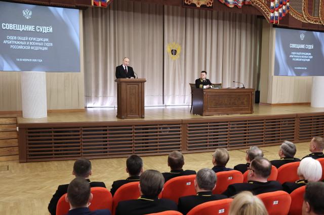 In this pool photograph distributed by the Russian state agency Sputnik, Russia's President Vladimir Putin speaks at an annual meeting of judges in Moscow on February 19, 2026. (Photo by Valery SHARIFULIN / POOL / AFP)