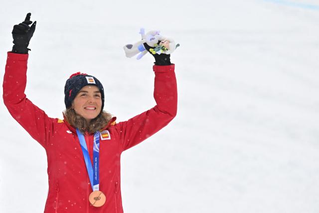 Bronze medallist Spain's Ana Alonso Rodriguez celebrates on the podium after competing in the women's sprint ski mountaineering event during the Milano Cortina 2026 Winter Olympic Games at the Stelvio Ski Centre in Bormio (Valtellina) on February 19, 2026. (Photo by Fabrice COFFRINI / AFP)