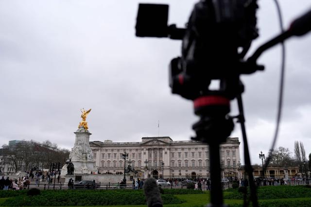 A video camera is pictured outside Buckingham Palace in London on February 19, 2026. Britain's former prince Andrew was arrested February 19, 2026 on suspicion of misconduct, with King Charles III saying in a statement "the law must take its course". The arrest follows new revelations last week that appeared to show Andrew sent convicted US sex offender Epstein potentially confidential documents during his time as a UK trade envoy. (Photo by CARLOS JASSO / AFP)