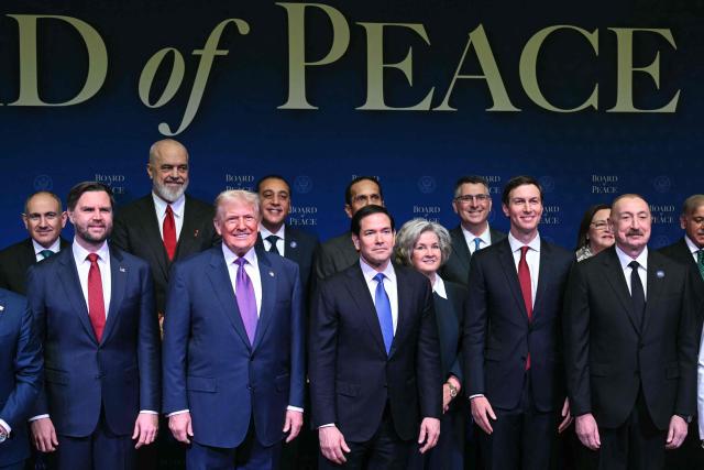 (Front row, L/R) US Vice President JD Vance, US President Donald Trump, US Secretary of State Marco Rubio, White House Chief of Staff Susie Wiles, Jared Kushner, and Azerbaijan's President Ilham Aliyev join leaders for a group photo during the inaugural meeting of the "Board of Peace" at the US Institute of Peace in Washington, DC, on February 19, 2026. President Trump on Thursday gathers allies to inaugurate the "Board of Peace," his new institution focused on progress on Gaza but whose ambitions reach much further. Around two dozen world leaders or other senior officials have come to Washington for the meeting -- including several of Trump's authoritarian-leaning friends and virtually none of the European democrats that traditionally sign on to US initiatives. (Photo by SAUL LOEB / AFP)