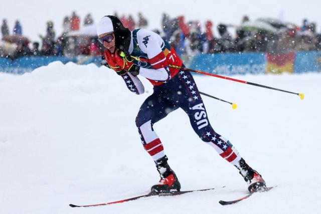 USA's Benjamin Loomis competes in the cross-country of the nordic combined team sprint large hill event at Tesero Cross Country Stadium at Lago di Tesero (Val di Fiemme) during the Milano Cortina 2026 Winter Olympic Games on February 19, 2026. (Photo by Anne-Christine POUJOULAT / AFP)