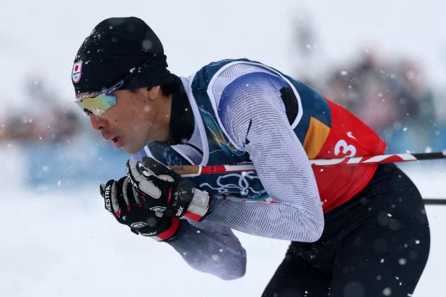 Japan's Akito Watabe competes in the cross-country of the nordic combined team sprint large hill event at Tesero Cross Country Stadium at Lago di Tesero (Val di Fiemme) during the Milano Cortina 2026 Winter Olympic Games on February 19, 2026. (Photo by Anne-Christine POUJOULAT / AFP)