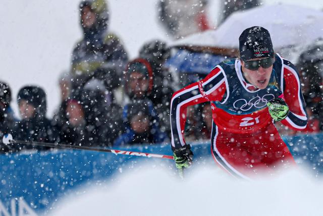 Norway's Andreas Skoglund competes in the cross-country of the nordic combined team sprint large hill event at Tesero Cross Country Stadium at Lago di Tesero (Val di Fiemme) during the Milano Cortina 2026 Winter Olympic Games on February 19, 2026. (Photo by Anne-Christine POUJOULAT / AFP)