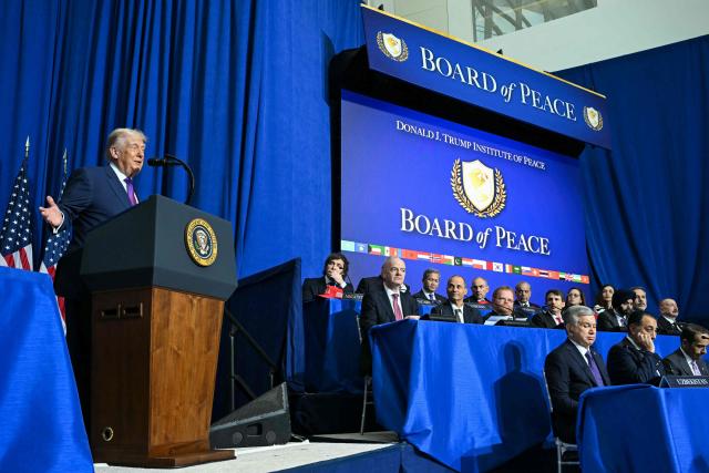 US President Donald Trump (L) delivers remarks during the inaugural meeting of the "Board of Peace" at the US Institute of Peace in Washington, DC, on February 19, 2026. President Trump on Thursday gathers allies to inaugurate the "Board of Peace," his new institution focused on progress on Gaza but whose ambitions reach much further. Around two dozen world leaders or other senior officials have come to Washington for the meeting -- including several of Trump's authoritarian-leaning friends and virtually none of the European democrats that traditionally sign on to US initiatives. (Photo by SAUL LOEB / AFP)