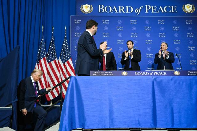 US President Donald Trump (L) arrives as, L/R, US Vice President JD Vance, US Secretary of State Marco Rubio, and White House Special Envoy Steve Witkoff applaud during the inaugural meeting of the "Board of Peace" at the US Institute of Peace in Washington, DC, on February 19, 2026. President Trump on Thursday gathers allies to inaugurate the "Board of Peace," his new institution focused on progress on Gaza but whose ambitions reach much further. Around two dozen world leaders or other senior officials have come to Washington for the meeting -- including several of Trump's authoritarian-leaning friends and virtually none of the European democrats that traditionally sign on to US initiatives. (Photo by SAUL LOEB / AFP)