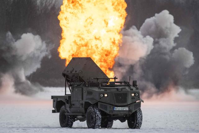 A Polish-made BLUSZCZ – unmanned mine-scattering vehicle is pictured during an open test of unmanned weapon systems conducted by the Polish Armaments Group (Polska Grupa Zbrojeniowa) at the Military Institute of Armament Technology training ground in Zielonka, Warsaw suburbia, on February 19, 2026. (Photo by Wojtek RADWANSKI / AFP)