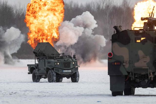 A Polish-made BLUSZCZ – unmanned mine-scattering vehicle is pictured during an open test of unmanned weapon systems conducted by the Polish Armaments Group (Polska Grupa Zbrojeniowa) at the Military Institute of Armament Technology training ground in Zielonka, Warsaw suburbia, on February 19, 2026. (Photo by Wojtek RADWANSKI / AFP)