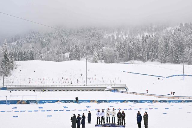 (From centre L) Silver medalist Finland's Ilkka Herola and Finland's Eero Hirvonen, gold medallist Norway's Jens Luraas Oftebro, Norway's Andreas Skoglund, and bronze medallist Austria's Johannes Lamparter and Austria's Stefan Rettenegger celebrate on the podium following the nordic combined team sprint large hill event at Tesero Cross Country Stadium at Lago di Tesero (Val di Fiemme) during the Milano Cortina 2026 Winter Olympic Games on February 19, 2026.  (Photo by Javier SORIANO / AFP)