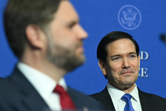 (L/R) US Vice President JD Vance and US Secretary of State Marco Rubio attend the inaugural meeting of the "Board of Peace" hosted by US President Donald Trump at the US Institute of Peace in Washington, DC, on February 19, 2026. President Trump on Thursday gathers allies to inaugurate the "Board of Peace," his new institution focused on progress on Gaza but whose ambitions reach much further. Around two dozen world leaders or other senior officials have come to Washington for the meeting -- including several of Trump's authoritarian-leaning friends and virtually none of the European democrats that traditionally sign on to US initiatives. (Photo by SAUL LOEB / AFP)