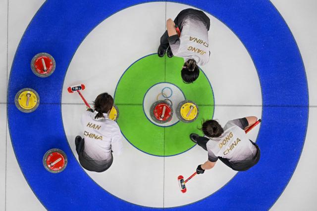 China's team competes in the curling women's round robin between Japan and China during the Milano Cortina 2026 Winter Olympic Games at the Cortina Curling Olympic Stadium in Cortina d’Ampezzo on February 19, 2026. (Photo by Franзois-Xavier MARIT / AFP)