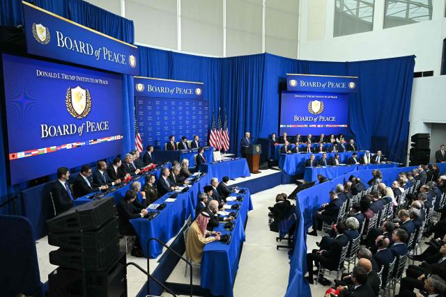 US President Donald Trump (C, at podium) delivers remarks during the inaugural meeting of the "Board of Peace" at the US Institute of Peace in Washington, DC, on February 19, 2026. President Trump on Thursday gathers allies to inaugurate the "Board of Peace," his new institution focused on progress on Gaza but whose ambitions reach much further. Around two dozen world leaders or other senior officials have come to Washington for the meeting -- including several of Trump's authoritarian-leaning friends and virtually none of the European democrats that traditionally sign on to US initiatives. (Photo by SAUL LOEB / AFP)