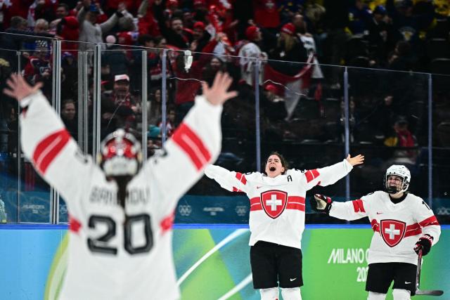 Switzerland's #25 Alina Muller (C)  celebrates after winning the women's bronze medal ice hockey match between Switzerland and Sweden at the Milano Santagiulia Ice Hockey Arena during the Milano Cortina 2026 Winter Olympic Games in Milan, on February 19, 2026. (Photo by JULIEN DE ROSA / AFP)