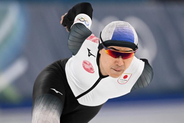 Japan's Kazuya Yamada competes in the speed skating men's 1500m during the Milano Cortina 2026 Winter Olympic Games at Milano Speed Skating Stadium in Milan on February 19, 2026. (Photo by Daniel MUNOZ / AFP)