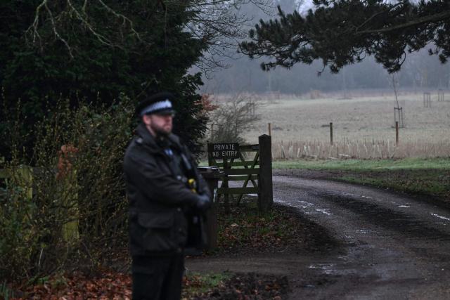 A policeman stands at an entrance to Wood Farm on the royal family's Sandringham Estate in Norfolk, eastern England on February 19, 2026, where former prince Andrew was arrested earlier in the day. Britain's royal family was in crisis on February 19 as former prince Andrew was in police custody after being arrested on suspicion of misconduct for his links to late US sex offender Jeffrey Epstein. (Photo by JUSTIN TALLIS / AFP)