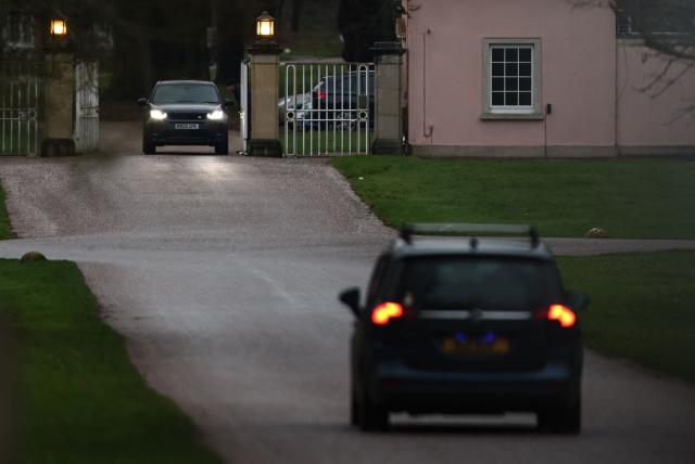 Cars are pictured at the entrance to the Royal Lodge, a 30-room property and former residence to Britain's former prince Andrew, at Windsor Great Park in Windsor, Berkshire on February 19, 2026, which was reportedly searched by police while Andrew was arrested earlier in the day at the king's private Sandringham estate in Norfolk. Britain's royal family was in crisis on February 19 as former prince Andrew was in police custody after being arrested on suspicion of misconduct for his links to late US sex offender Jeffrey Epstein. (Photo by Toby Shepheard / AFP)