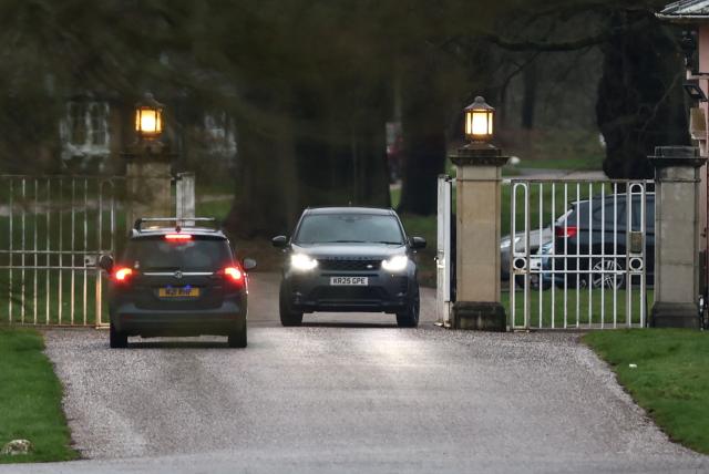 Cars are pictured at the entrance to the Royal Lodge, a 30-room property and former residence to Britain's former prince Andrew, at Windsor Great Park in Windsor, Berkshire on February 19, 2026, which was reportedly searched by police while Andrew was arrested earlier in the day at the king's private Sandringham estate in Norfolk. Britain's royal family was in crisis on February 19 as former prince Andrew was in police custody after being arrested on suspicion of misconduct for his links to late US sex offender Jeffrey Epstein. (Photo by Toby Shepheard / AFP)