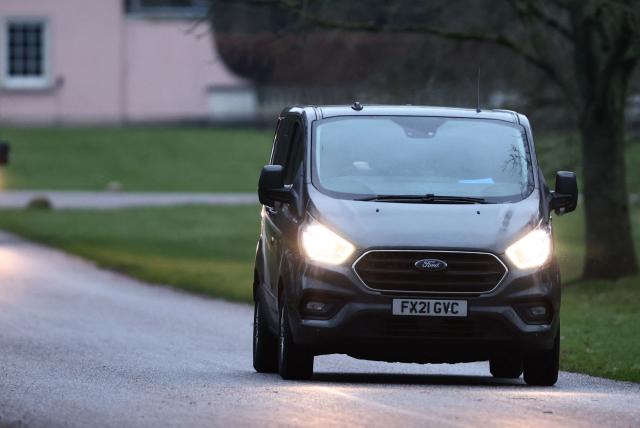 A Van drives away from the entrance to the Royal Lodge, a 30-room property and former residence to Britain's former prince Andrew, at Windsor Great Park in Windsor, Berkshire on February 19, 2026, which was reportedly searched by police while Andrew was arrested earlier in the day at the king's private Sandringham estate in Norfolk. Britain's royal family was in crisis on February 19 as former prince Andrew was in police custody after being arrested on suspicion of misconduct for his links to late US sex offender Jeffrey Epstein. (Photo by Toby Shepheard / AFP)