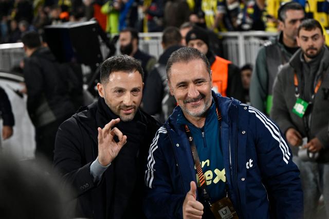 Fenerbahce's Italian head coach Domenico Tedesco (L) and Nottingham Forest's Portuguese Vitor Pereira (R) pose for a photograph ahead of the UEFA Europa League - knockout round play-off first leg - football match between Fenerbahce SK and Nottingham Forest FC at the Sukru Saracoglu Stadium in Istanbul on February 19, 2026. (Photo by Yasin AKGUL / AFP)