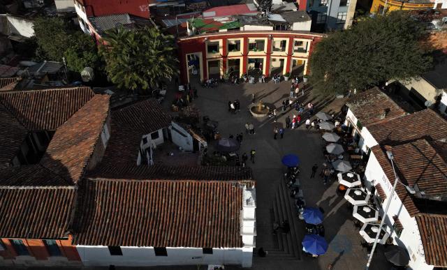 Aerial view of Plaza del Chorro de Quevedo, a historic square considered the birthplace of the city and located in the Candelaria neighborhood, a major tourist attraction in Bogota, on February 17, 2026. (Photo by Raul ARBOLEDA / AFP)