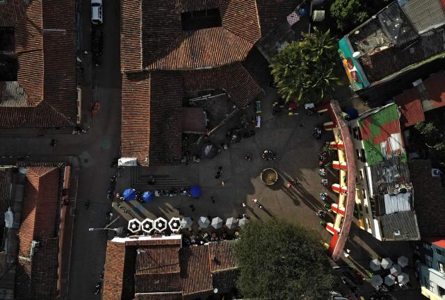 Aerial view of Plaza del Chorro de Quevedo, a historic square considered the birthplace of the city and located in the Candelaria neighborhood, a major tourist attraction in Bogota, on February 17, 2026. (Photo by Raul ARBOLEDA / AFP)