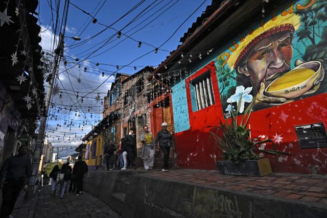 View of a mural on a street leading to Plaza del Chorro de Quevedo, a historic square considered the birthplace of the city and located in the Candelaria neighborhood, one of Bogota’s main tourist attractions, on February 17, 2026. (Photo by Raul ARBOLEDA / AFP)