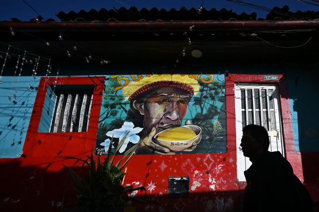 View of a mural on a street leading to Plaza del Chorro de Quevedo, a historic square considered the birthplace of the city and located in the Candelaria neighborhood, one of Bogota’s main tourist attractions, on February 17, 2026. (Photo by Raul ARBOLEDA / AFP)