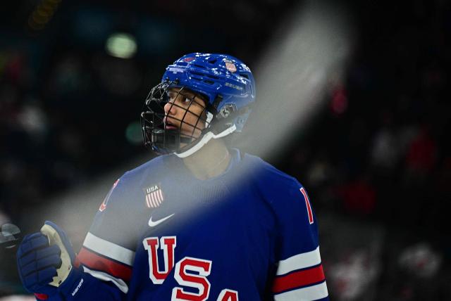 USA's #10 Laila Edwards warms up prior to the women's gold medal ice hockey match between USA and Canada at the Milano Santagiulia Ice Hockey Arena during the Milano Cortina 2026 Winter Olympic Games in Milan, on February 19, 2026. (Photo by JULIEN DE ROSA / AFP)