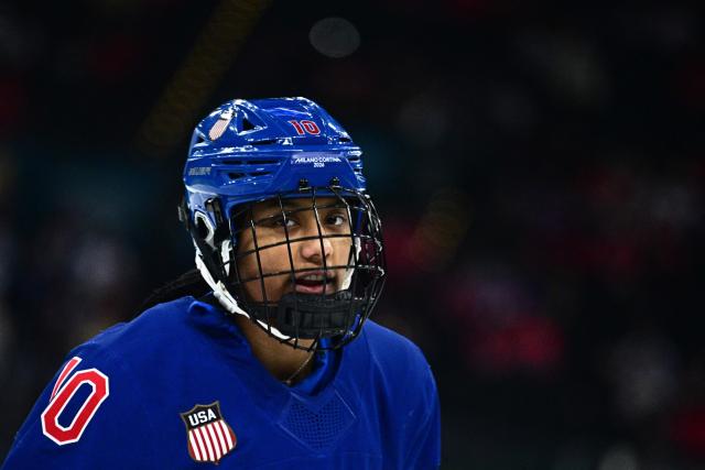 USA's #10 Laila Edwards warms up prior to the women's gold medal ice hockey match between USA and Canada at the Milano Santagiulia Ice Hockey Arena during the Milano Cortina 2026 Winter Olympic Games in Milan, on February 19, 2026. (Photo by JULIEN DE ROSA / AFP)