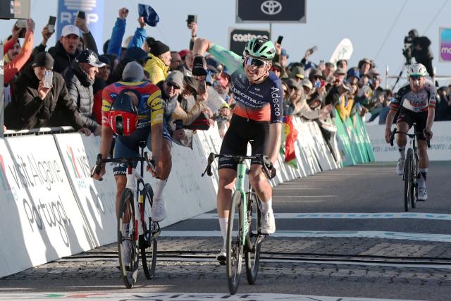 Decathlon CMA CGM Team French cyclist Paul Seixas (C) celebrates as he crosses the finish line in first place next to Lidl-Trek Spanish cyiclist Juan Ayuso (L) during the second stage of the 52nd edition of the Volta ao Algarve, a 147.2 km race between Portimao and Foia, Monchique, on February 19, 2026. (Photo by João Matos / AFP)