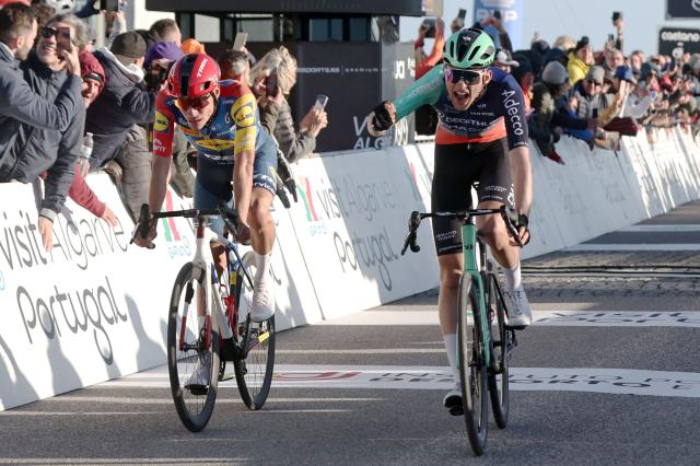 Decathlon CMA CGM Team French cyclist Paul Seixas (R) celebrates as he crosses the finish line in first place next to Lidl-Trek Spanish cyiclist Juan Ayuso during the second stage of the 52nd edition of the Volta ao Algarve, a 147.2 km race between Portimao and Foia, Monchique, on February 19, 2026. (Photo by João Matos / AFP)