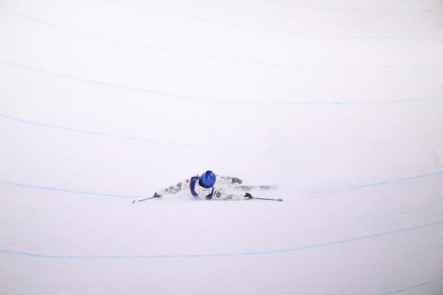 China's Gu Ailing Eileen competes in the freestyle skiing women's freeski halfpipe qualification run 1 during the Milano Cortina 2026 Winter Olympic Games at Livigno Snow Park, in Livigno (Valtellina), on February 19, 2026. (Photo by Kirill KUDRYAVTSEV / AFP)