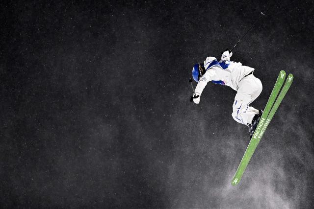 China's Gu Ailing Eileen competes in the freestyle skiing women's freeski halfpipe qualification run 1 during the Milano Cortina 2026 Winter Olympic Games at Livigno Snow Park, in Livigno (Valtellina), on February 19, 2026. (Photo by Kirill KUDRYAVTSEV / AFP)