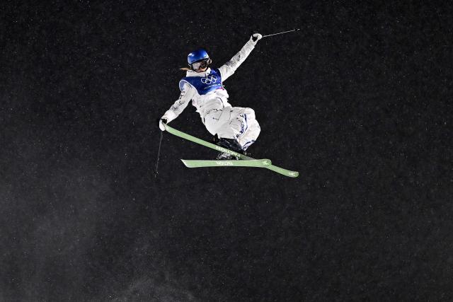 China's Gu Ailing Eileen competes in the freestyle skiing women's freeski halfpipe qualification run 1 during the Milano Cortina 2026 Winter Olympic Games at Livigno Snow Park, in Livigno (Valtellina), on February 19, 2026. (Photo by Kirill KUDRYAVTSEV / AFP)