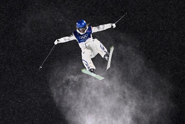 China's Gu Ailing Eileen competes in the freestyle skiing women's freeski halfpipe qualification run 1 during the Milano Cortina 2026 Winter Olympic Games at Livigno Snow Park, in Livigno (Valtellina), on February 19, 2026. (Photo by Kirill KUDRYAVTSEV / AFP)