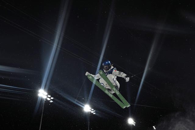 China's Gu Ailing Eileen competes in the freestyle skiing women's freeski halfpipe qualification run 2 during the Milano Cortina 2026 Winter Olympic Games at Livigno Snow Park, in Livigno (Valtellina), on February 19, 2026. (Photo by Jeff PACHOUD / AFP)