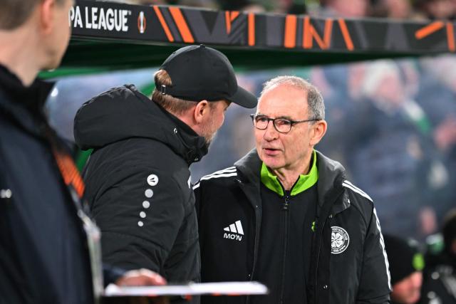 Celtic's Northern Irish Interim manager Martin O'Neill (R) and Stuttgart's German head coach Sebastian Hoeness (L) chat ahead of kick-off in the UEFA Europa League knockout round playoff, 1st leg football match between Celtic and Stuttgart at Celtic Park in Glasgow on February 19, 2026. (Photo by ANDY BUCHANAN / AFP)