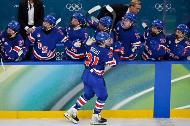 USA's #21 Hilary Knight celebrates scoring her team's first goal during the women's gold medal ice hockey match between USA and Canada at the Milano Santagiulia Ice Hockey Arena during the Milano Cortina 2026 Winter Olympic Games in Milan, on February 19, 2026. (Photo by Alexander NEMENOV / AFP)