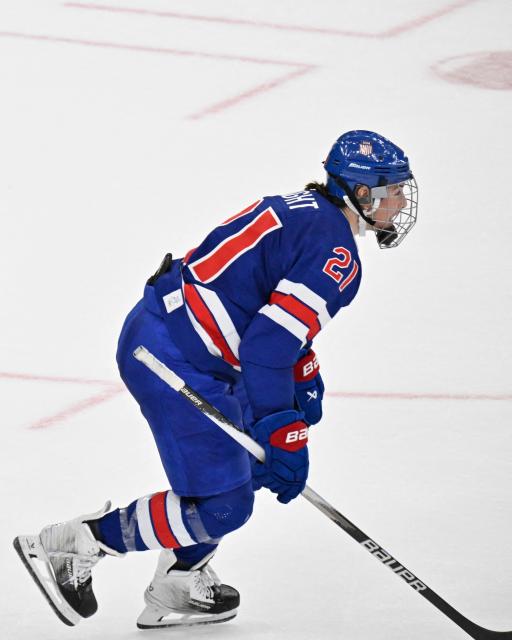 USA's #21 Hilary Knight celebrates scoring her team's first goal during the women's gold medal ice hockey match between USA and Canada at the Milano Santagiulia Ice Hockey Arena during the Milano Cortina 2026 Winter Olympic Games in Milan, on February 19, 2026. (Photo by Alexander NEMENOV / AFP)