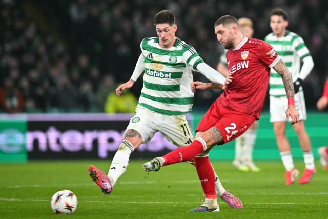 Celtic's Czech striker #11 Tomes Cvancara (L) vies with Stuttgart's German defender #24 Jeff Chabot (R) during the UEFA Europa League knockout round playoff, 1st leg football match between Celtic and Stuttgart at Celtic Park in Glasgow on February 19, 2026. (Photo by ANDY BUCHANAN / AFP)