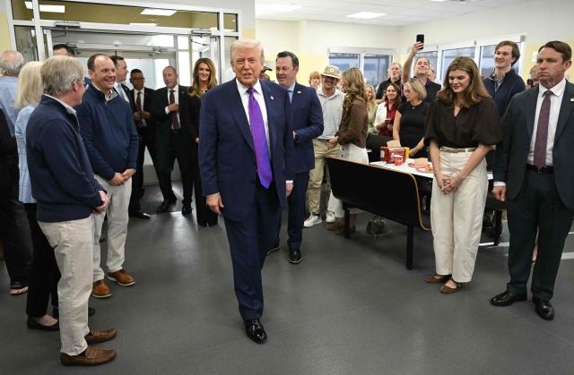 US President Donald Trump, joined by Georgia Lieutenant Governor Burt Jones (R), visits The Varsity restaurant in Rome, Georgia on February 19, 2026. (Photo by SAUL LOEB / AFP)